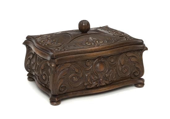 A Carved Walnut Box of shaped rectangular 1561ec