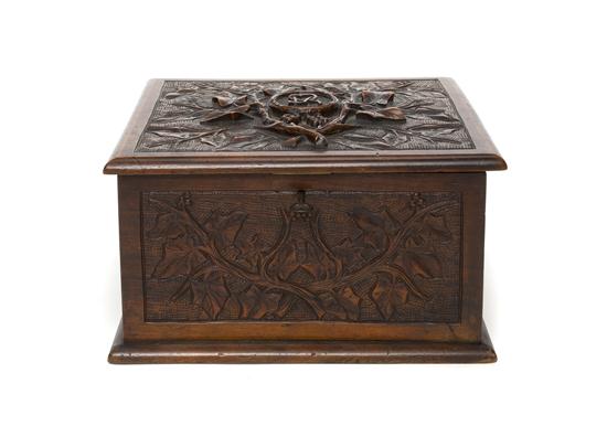 A Carved Walnut Jewelry Box of