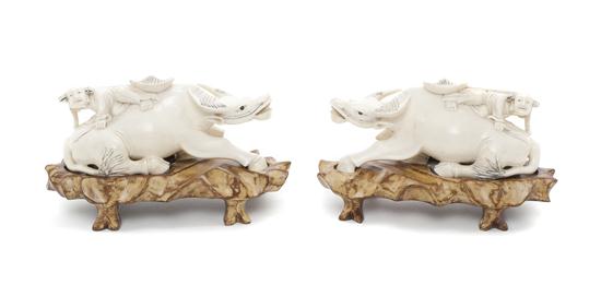 A Pair of Chinese Carved Ivory Buffalo