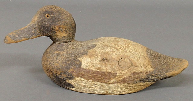 Carved duck decoy with glass eyes. 6.5h.x14.5l.