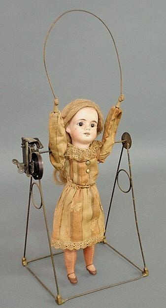 French bisque head automation doll jumping
