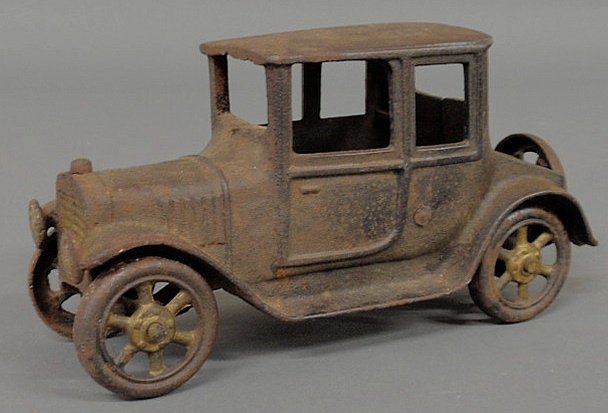 Cast iron toy car. 4.25h.x8.25l.