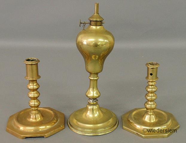 Two similar Continental brass candlesticks 1595e0