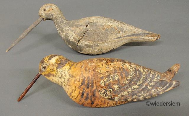 Two carved shore birds largest