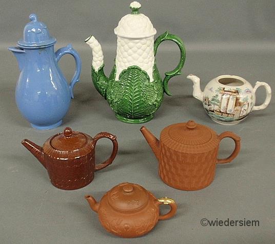 Five ceramic and earthenware teapots