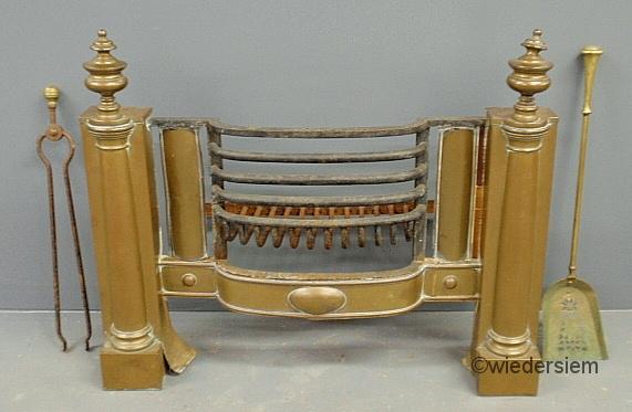 Brass and metal grated fireplace insert
