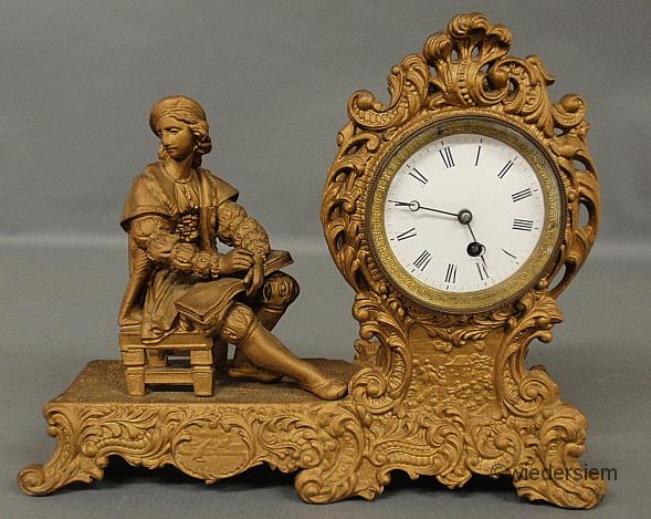Spelter metal mantel clock with a porcelain