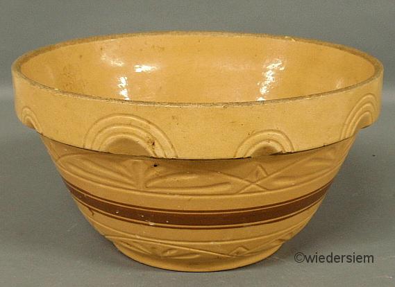 Yellow ware mixing bowl by R.R.P. Co.