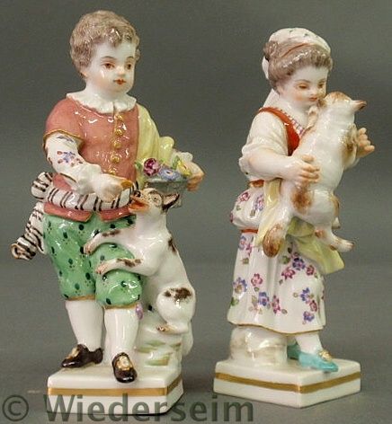 Two small Meissen figures- a boy