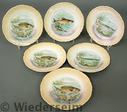 Set of six German decorated fish plates.