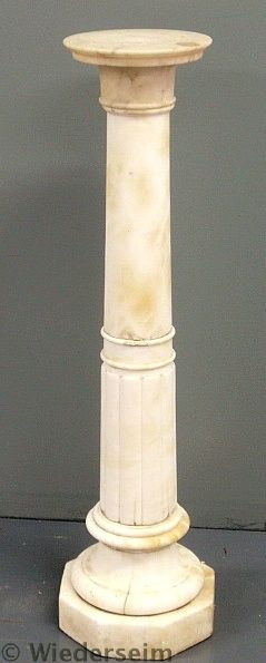 Marble pedestal with a round rotating