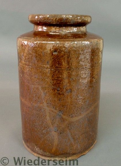 Glazed redware canister 19th c. 10.5h.