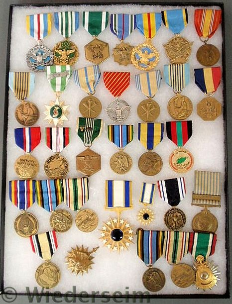 Cased tray of U.S. service medals spanning