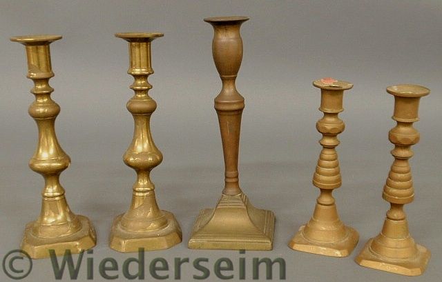 Two pairs of English brass candlesticks