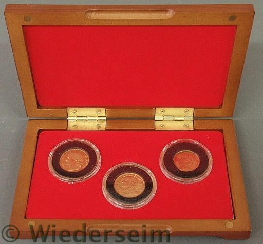 Cased set of three Swiss gold coins 159acc