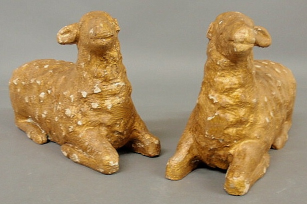 Two carved recumbent sheep late