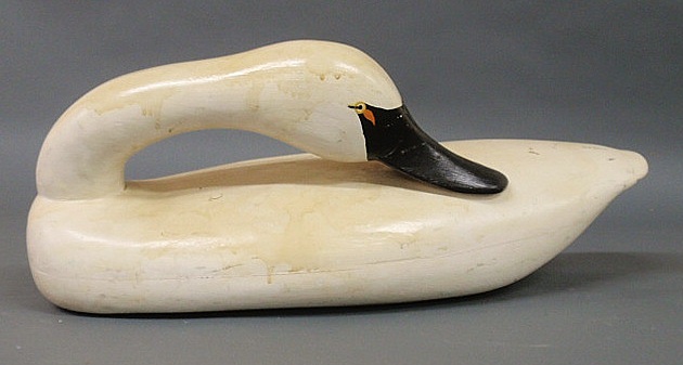 Carved life-size preening swan
