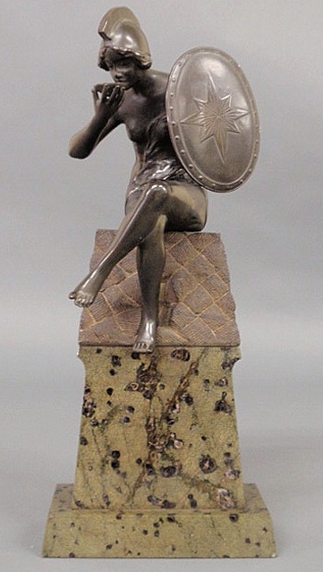 Bronze figure of a seated female warrior