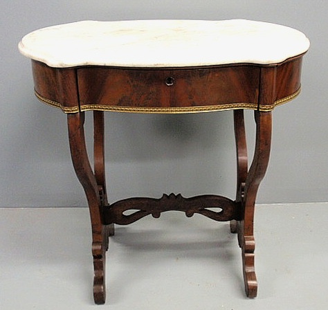 Empire mahogany table with a shaped