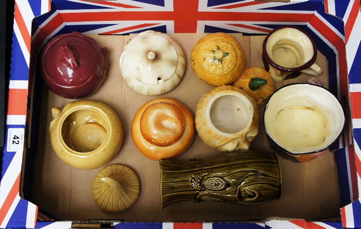 A collection of old kitchen jars comprising