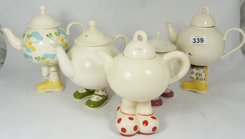 A collection of Cartlon Ware Tea Pots