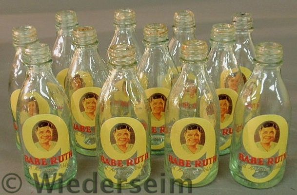 Twelve glass Babe Ruth bottles
