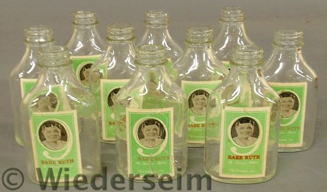 Set of ten bottles with paper labels