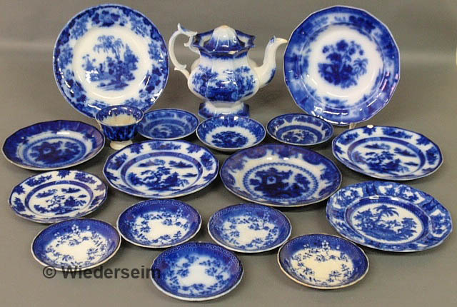 Eighteen pieces of Flow Blue tableware