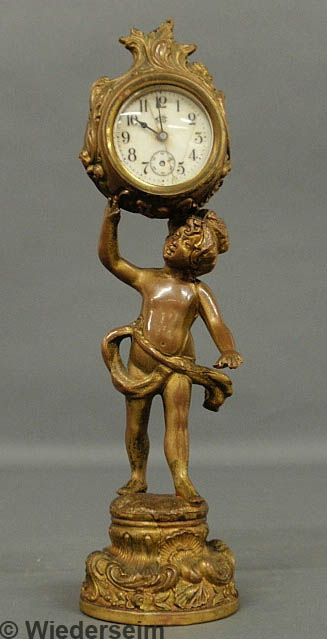 Gilt metal clock by Jennings Brothers