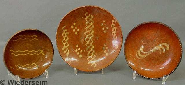 Three Pennsylvania redware pie plates