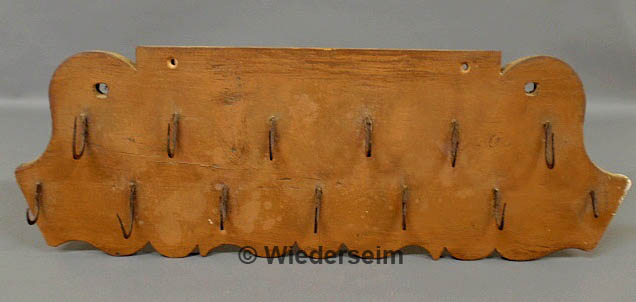 Carved and painted hanging rack 158a23