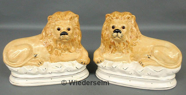 Pair of Staffordshire seated lions 158a50