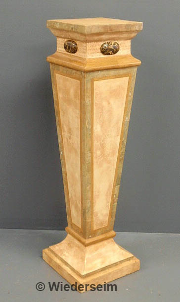 Wood pedestal with a faux marble finish