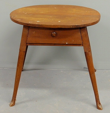 Walnut oval top tavern table 20th c.