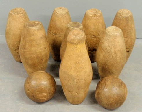 Set of eight carved bowling pins