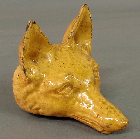 Yellow glazed sewer tile fox head 158f3f