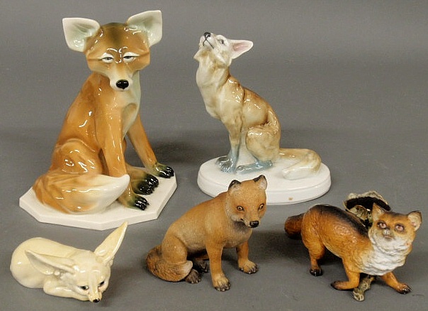 Group of five ceramic foxes.
