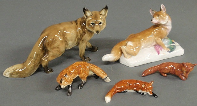 Group of five ceramic foxes largest