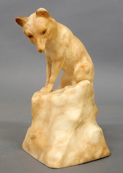 Carved alabaster figure of a seated
