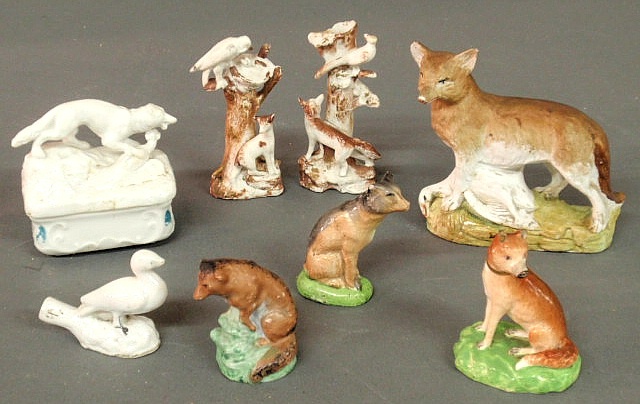 Six porcelain fox figures a covered