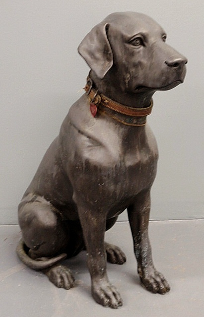 Cast metal seated dog garden ornament