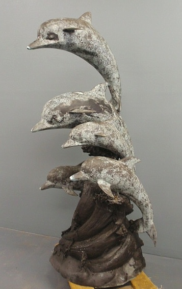 Cast metal with faux bronze finish dolphin