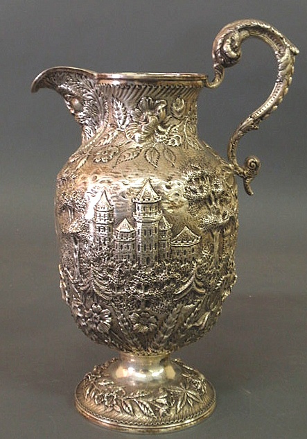 Sterling silver ewer with a repouss?