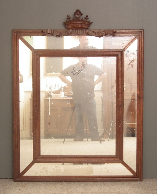 An oak framed rectangular wall mirror