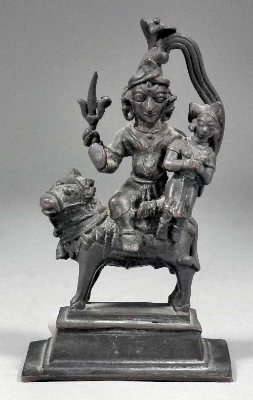 An Asian cast bronze figure modelled