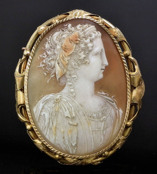 A Victorian gold coloured metal oval