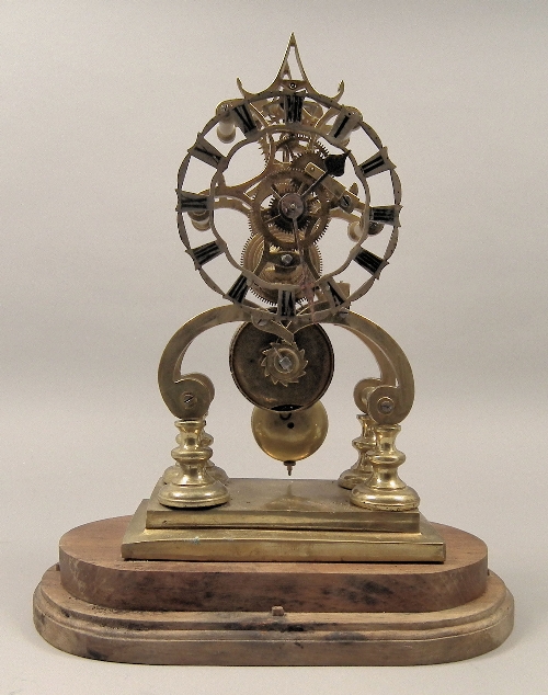 A brass framed ''Skeleton'' clock