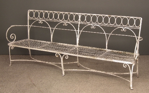 A white painted wrought iron garden