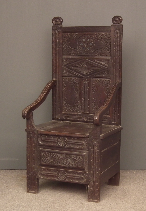 An old Black Oak panelled armchair 15c1b2