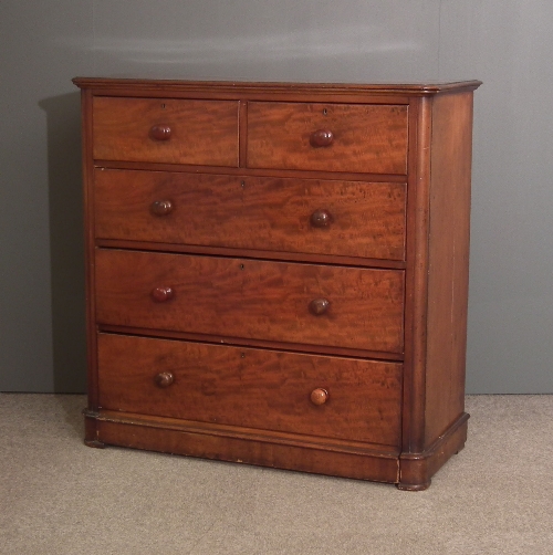 A Victorian figured mahogany chest of